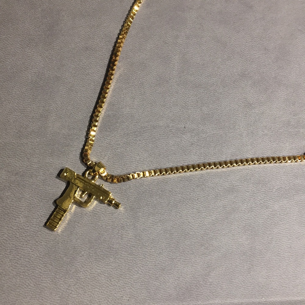 Gold uzi necklace